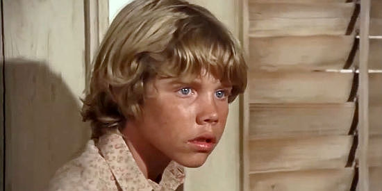 Eric Shea as Booton MacAvoy, checking in on the stranger who washed ashore in The Castaway Cowboy (1974)