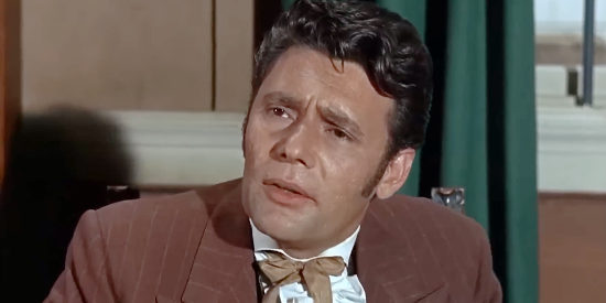 Harry Guardino as Sam Trimble, the man who gives Arabella a job singing in his saloon in The Adventures of Bullwhip Griffin (1967)