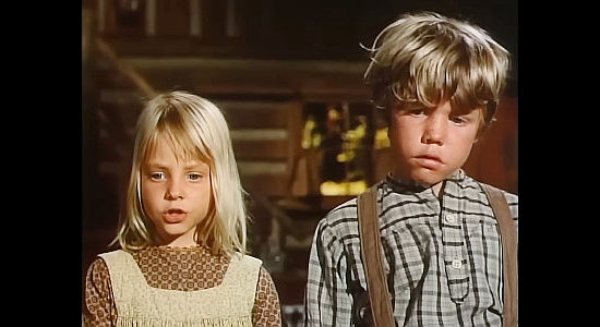 Jodie Foster as Suellen McIver, wondering why the Yank in her home doesn't have horns while brother Mark (Eric Shea) looks on in Menace on the Mountain (1970)