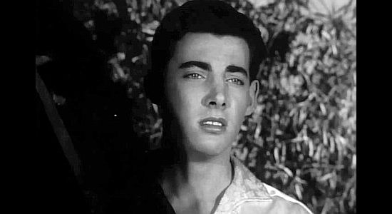 Sergio Virel as Manuel, the young man who has fallen for Maria in Half Way to Hell (1960)