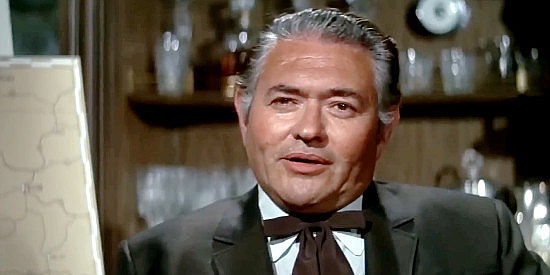 Simon Oakland as Barton Whittker, shocked by his son's change of heart regarding the dam project in Scandalous John (1969)