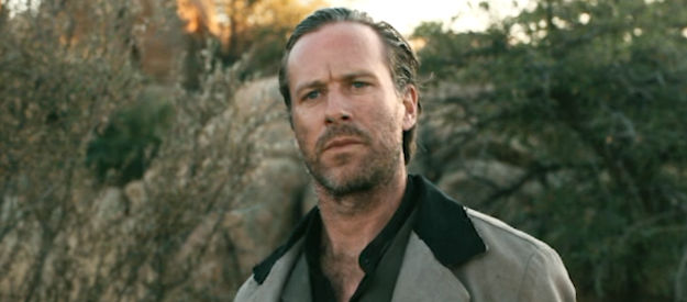 Armie Hammer as Edmund Fisher, an outlaw who relishes in other's pain in Frontier Crucible (2025)