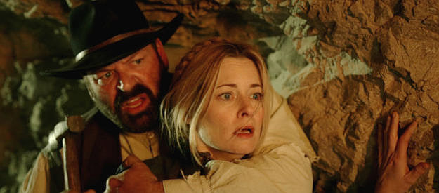 B.J. Mezek as Fred Rudolph and Jessica Moore as Julia Ann Smith fight to survive in Night of the Tommyknockers (2022)