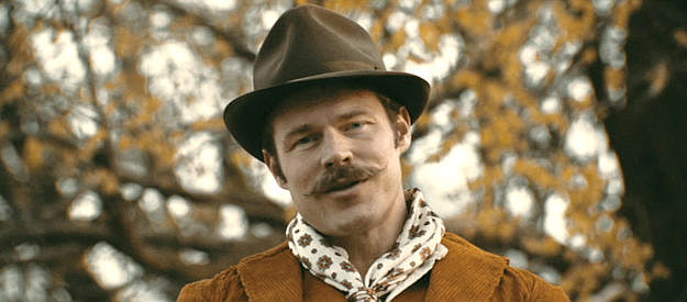 Brock Harris as Butch Cassidy, coercing Ed Dantes into the gang in Cottonmouth (2025)