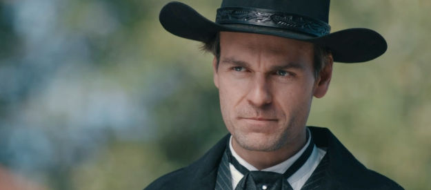 Chris Routhe as Harrison Griggs, warning residents of Pinemore that loyalty is demanded, defiance not allowed in Bad Man Must Bleed (2025)