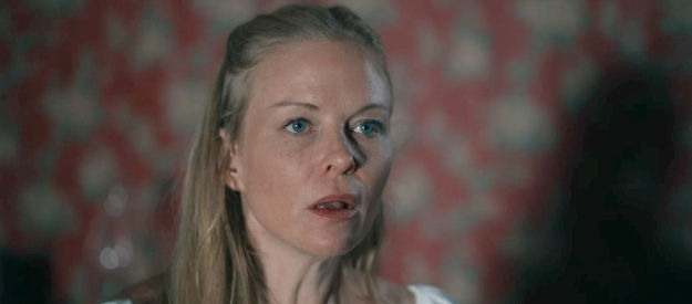 Constance Brenneman as Caroline, the woman who runs the orphanage, concerned about the fate of her husband in Bad Men Must Bleed (2025)