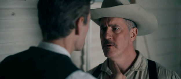 David D. Ford as Sheriff Taylor, the lawman in cahoots with Harrison Griggs in Bad Men Must Bleed (2025)