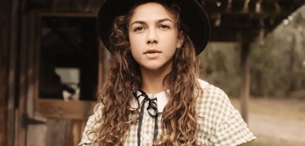 Freddee Hendricks as Annie Oakley, meeting a stranger who knows all about her aspirations in A Gunfighter's Deal (2025)