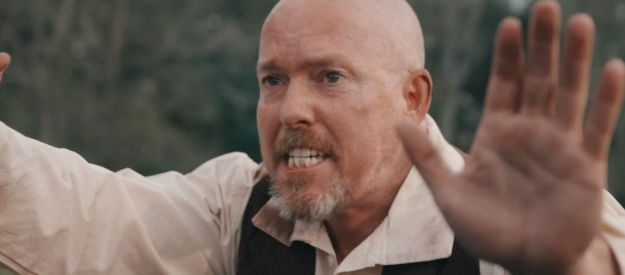 Holt Boggs as Bart, a member of the Harrison Briggs gang, trying to deliver a message in Bad Men Must Bleed (2025)