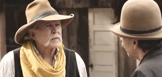Les McDowell as Sheriff Walt, getting orders not to stop the coming gunfight in A Gunfighter's Deal (2025)