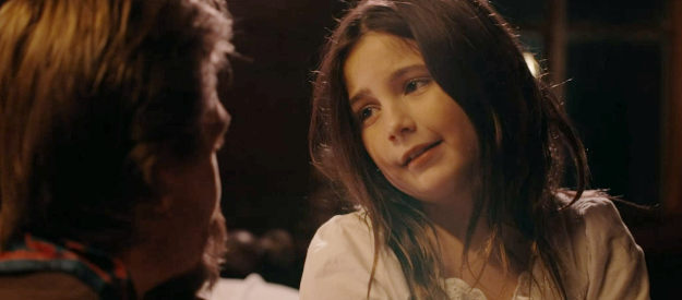 Lexi Rabe as Emma, trying to get her way with her father in Bad Men Must Bleed (2025)
