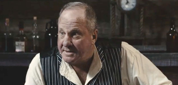 Michael Milhoan as Lou Stubbs, the bartender who befriends Silas Johnson in A Gunfighter's Deal (2025)