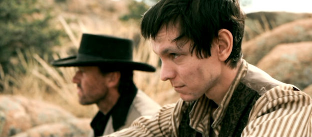 Ryan Masson as Billy McKee, the outlaw leader's son in Frontier Crucible (2025)
