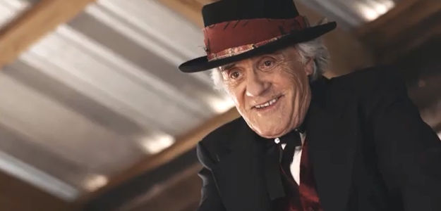 Terry Kiser as the Stranger who makes dreams come true in exchange for souls in A Gunfighter's Deal (2025)