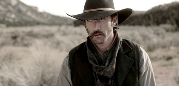 Adam Hightower as Earl Mitchell, the bandit who survives a brush with Ned Campbell in This Bloody Country (2025)