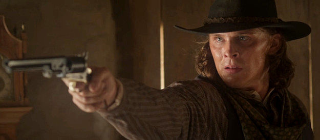 Blaine Maye as Marcus Dollar, ready to dole out a measure of revenge in Long Shadows (2025)