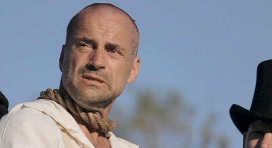 Brian Lutes as Percy Harris, with a noose around his neck and the realization that he might not fulfill that promise to his wife in One More Time Before I Die (2023)