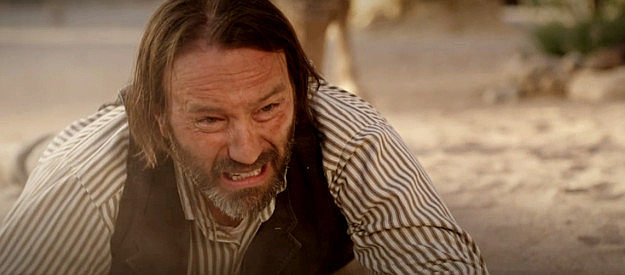 Brick Patrick as Preston Dollar, trying desperately to reach his wounded son in Long Shadows (2025)