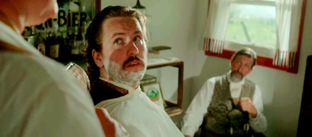 Darren Eisenhauer as Doc Holliday, discussing Waill Walker's death with the barber and Print Olive in Killin' Jim Kelly (2025)