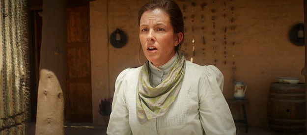 Dawn Marie as Rebecca Dollar, reacting when thieves arrive at the Dollar ranch in Long Shadows (2025)