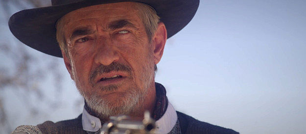 Dermot Mulroney as Dallas 'Deadeye' Garrett, the former outlaw now living on the Dollar land in Long Shadows (2025)