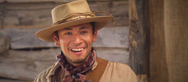 Edgar Santiago as Berto Medina, ready to help Marcus Dollar escape the marshal and his deputies in Long Shadows (2025)