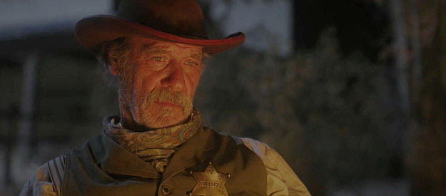 Grainger Hines as Wesley Tibbs, a marshal tired of taking lives and hoping to save one in Long Shadows (2025)