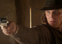 Blaine Maye as Marcus Dollar, ready to dole out a measure of revenge in Long Shadows (2025)