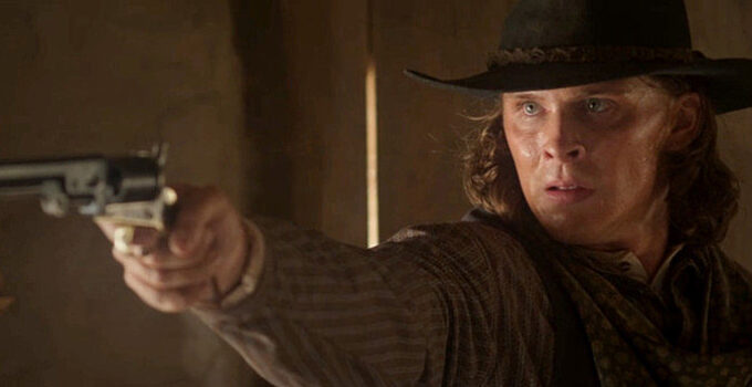Blaine Maye as Marcus Dollar, ready to dole out a measure of revenge in Long Shadows (2025)
