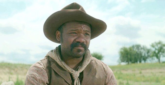 Patrick A. Grover as Jim Kelly, pondering the way he lives by the gun in Killin' Jim Kelly (2025)