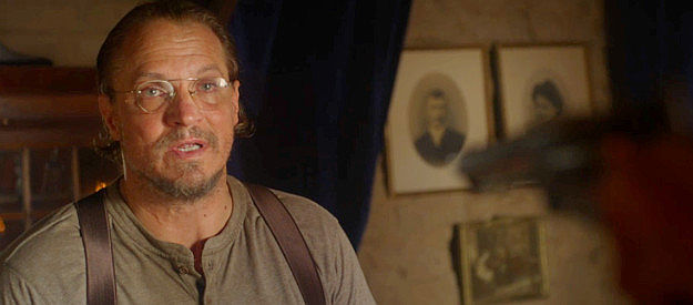 Ronnie Gene Blevins as Knox Weaver, haunted by the murders of Marcus's parents in Long Shadows (2025)