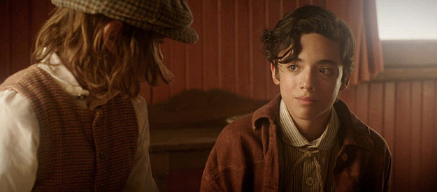 Ryder Franco as young Berto Medina, trying to convince Marcus to flee the ophanage with him in Long Shadows (2025)