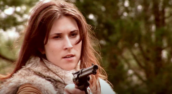 Alexis Celeste Elliott, aka Ace Elliott, as Laura, gun ready for action in The Magnificent Dead (2010)