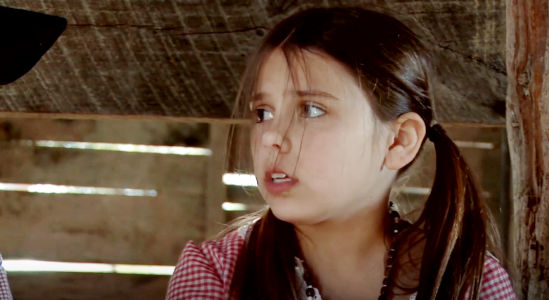 Ayla Judson as Shelby, a young girl concerned because the doctor thinks her caretaker has rabbies in The Magnificent Dead (2010)