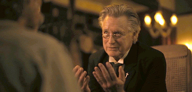 Bill Pullman as Preacher Ross, trying to convince Doc Bender of the presence of good and evil in Killing Faith (2025)
