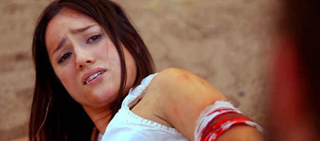 Celeste Luccitti as Bessie, wounded and trying to survive the barren southwest in Blood Totem (2026)