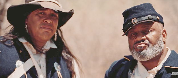 Edward Rodriquez as Joseph Proudfoot and Liza Davis as Sgt. Mahon, the two men serving under Capt. Rhodes in Blood Totem (2026)