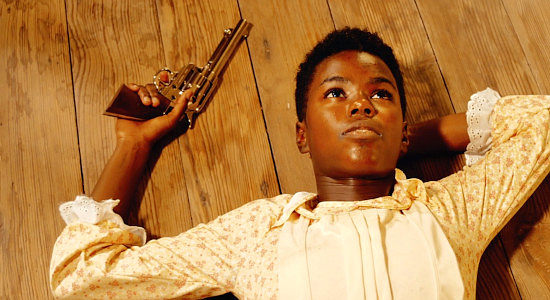 Ellen Harris as teenage Reina, reflecting on her first kill in Reina of the West (2022)