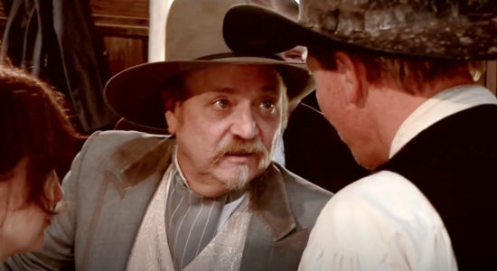 Fred Ellis as railroad man Harold Barnes, speaking with Rosewood's sheriff in The Magnificent Dead (2010)