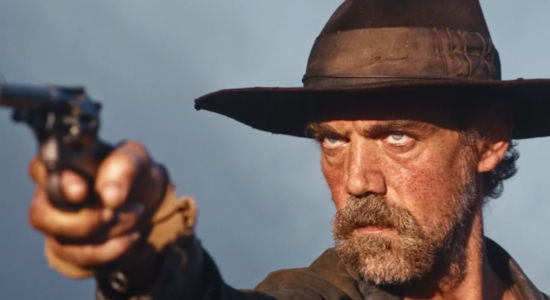 Gabriele Silli as Zecchino, springing into action when a train full of revolutionaries comes under attack in Heads or Tails (2025)