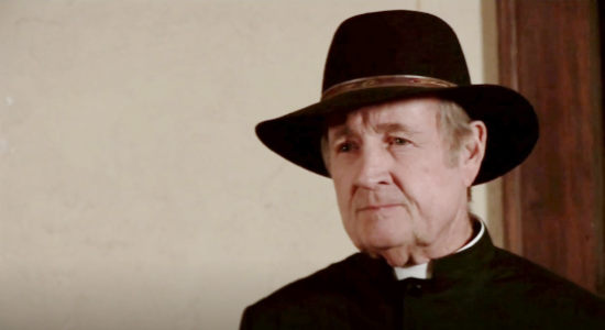 Jack Wilson as Father Harold, disillusioned by the infighting in Rosewood in The Magnificent Dead (2010)