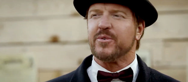 Jake Busey as Mr. York, announcing the shooting competition in Shooting Star (2022)