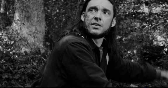 Kyle S. Brown as Curt Carter, back on Shine Mountain and eager for the gold-digging to begin in Buried on Shine Mountain (2024)