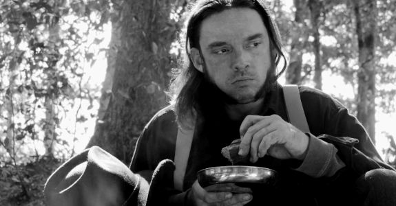Kyle S. Brown as Curt Carter, suspecting someone in the party is stashing away gold for himself in Buried on Shine Mountain (2024)