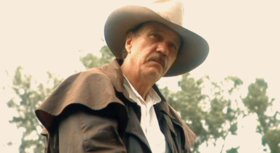 Larry Grant Harbin as the marshal who swears he buried a rancher named Colt in First Seal Revelations (2025)