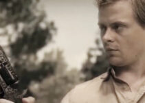 Drew Hirschboeck as Jack Wyatt, marveling over the power of a special six-gun in Jack Wyatt and the Gun from Hell (2021)
