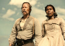 Guy Pearce as Doc Bender and DeWanda Wise as Sarah stumbling upon a tragic scene in Killing Faith (2025)