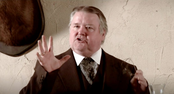 Rick Perkins as Mayor Wilks, the man who wants to bring the railroad to Rosewood in The Magnificent Dead (2010)