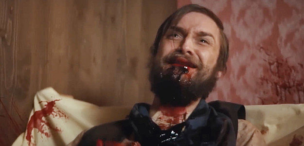 Sam Kozeluh as John Sparks, Frank's son, begging for mercy after being disembowed by a Skinwalker in A Town Called Purgatory (2025)