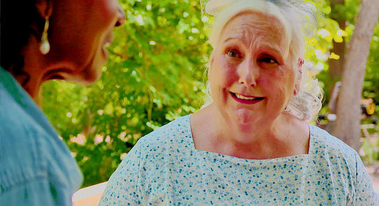 Vickey Dempsey Burns as Mary, formerly a whore named Myra, confessing past sins in Reina of the West (2022)